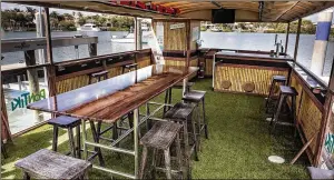  ?? PHOTOS BY DAMON HIGGINS / THE PALM BEACH POST ?? The interior of the Shaka. The 45-foot aluminum catamaran, a “pontiki” boat, launched last month, and ferries people to the Jupiter Inlet.