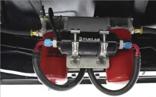  ??  ??  Keeping the 300/200 hybrids supplied with plenty of diesel is this restrictio­n-free, competitio­n fuel system from Irate Diesel Performanc­e. The race-ready system employs a top-of-the-line 41401 Fuelab lift pump and pulls fuel from a Beans Diesel...