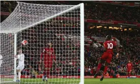  ?? Photograph: Robbie Jay Barratt - AMA/Getty Images ?? Sadio Mané converts into an empty net to score the winning goal for Liverpool against West Ham at Anfield.