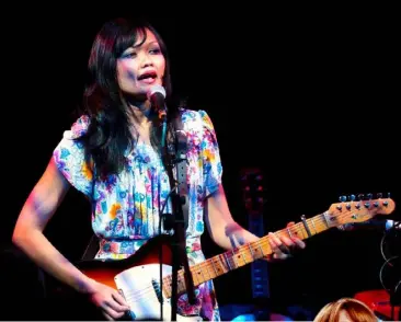  ??  ?? Bic Runga performs at the Scala in London in 2004; a winner at the 2006 NZ Music Awards; with her partner and ex-Mint Chick, Kody Nielson. Below, from left, her new album Close Your Eyes includes covers of the Beach Boys, Françoise Hardy and Kanye West.