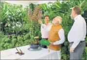  ?? PTI PHOTO/PRESS INFORMATIO­N BUREAU ?? Prime Minister Narendra Modi during his visit to the National Orchid Garden, where a flower was named after him, in Singapore on Saturday.