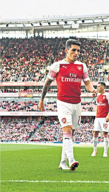  ??  ?? Long way from home: Lucas Torreira has made an instant impression since joining Arsenal, (left, with Watford’s Will Hughes). But he has never forgotten his roots (right, with his mother)