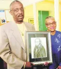  ?? JOSHUA MCKERROW/CAPITAL GAZETTE ?? Kirby McKinney and Alice Ford with a drawing of Edwin Stanton, Lincoln’s Secretary of War at the Stanton Center on June, 21, 2005.