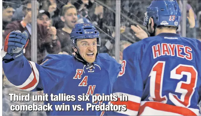  ?? USA TODAY Sports ?? HOW DOES THAT GRAB’ YOU? Kevin Hayes and Michael Grabner celebrate after Grabner scored a second-period goal Thursday night against the Predators. Hayes, Grabner and J.T. Miller accounted for six points as the Rangers won their fourth game in a row.