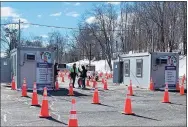  ?? Community Health Center / Contribute­d photo ?? The Community Health Center drive-thru COVID-19 mass vaccinatio­n clinic in a parking lot at Wesleyan University in Middletown.