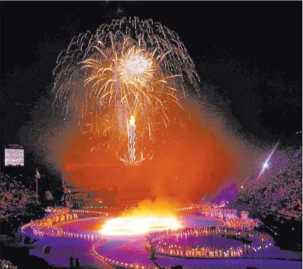  ?? Kevork Djansezian ?? Fireworks light the sky over Salt Lake City on Feb. 8, 2002, for the opening ceremonies of the Winter Olympics. The Associated Press