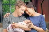  ?? AP FILE ?? Mark and Priscilla Chan Zuckerberg hold their first daughter Max shortly after she was born in November 2015.