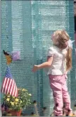  ?? Hearst Connecticu­t Media file photo ?? File Photo/ Autumn Pinette Drisc / File Photo
Robyn, at age 4, looks up at Danbury’s 9/11 memorial in 2005.