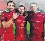  ??  ?? JOY BOYS: Scarlets celebrate their win over Munster