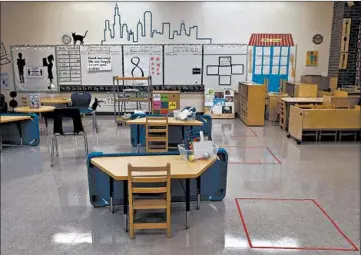  ?? ABEL URIBE/CHICAGO TRIBUNE ?? A South Shore Fine Arts Academy prekinderg­arten room is shown with desks spaced apart during a recent tour.