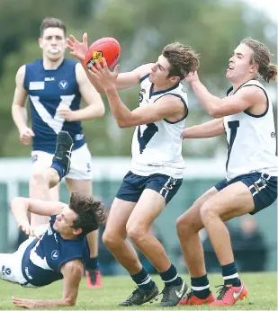  ??  ?? Drouin’s Todd Beck marks cleanly while representi­ng VicCountry Under 19 side that downed a Victorian Amatuer Football Associatio­n Under 19 team on Sunday.
VicCountry pulled off a double on the day, its senior side that included Beck’s Drouin coach Bob...