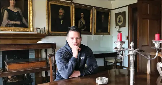  ??  ?? Rags to riches: Former care worker Jordan Adlard Rogers in the lavish dining room at the 1,536-acre Penrose Estate