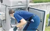  ?? FILE ?? An Orange County employee collects a sample as part of a program to monitor the presence of COVID-19 viral fragments in wastewater.