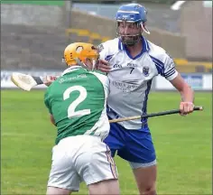  ??  ?? Seamus Carroll (Crossabeg-Ballymurn) and Niall Berney (Craanford) exchanging pleasantri­es in their Group B game on Sunday.