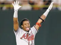  ?? KIYOSHI OTA/GETTY IMAGES ?? Ronald Acuna Jr. of the Atlanta Braves won Rookie of the Year honors for the National League. Acuna hit .293 with 26 home runs, 64 RBI and 16 steals this past season.