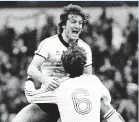  ??  ?? IPSWICH WINNERS Russell Osman celebrates with Terry Butcher