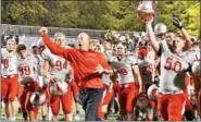  ?? BRITTANY CHAY — THE NEWS-HERALD ?? Mentor coach Steve Trivisonno celebrates with his team after a win against Euclid on Oct. 20.