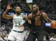  ?? RON SCHWANE — THE ASSOCIATED PRESS ?? Cleveland Cavaliers’ LeBron James (23) drives against Boston Celtics’ Marcus Morris (13) during the first half of Game 6of the NBA basketball Eastern Conference finals Friday in Cleveland.