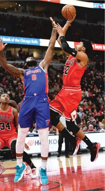  ?? PAUL BEATY/AP ?? Bulls forward Otto Porter Jr., who finished with 22 points, shoots over the Pistons’ Andre Drummond.