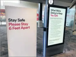  ?? TED SLOWIK/DAILY SOUTHTOWN ?? Signs at Orland Square mall in Orland Park outline efforts to keep customers safe as the center reopens.