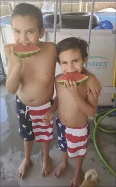  ?? PHOTO CHRIS SANCHEZ ?? Watermelon and pool time for this quarantine Fourth of July.
