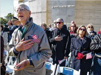  ?? PHOTOS BY STEVE SCHAEFER / SPECIAL TO THE AJC ?? Martin Berning sings the national anthem at the beginning of the Veterans Day commemorat­ion at the Atlanta History Center on Sunday. This year’s ceremony also recognized the 100th anniversar­y of the end of World War I.