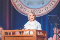  ?? EDDIE MOORE/JOURNAL ?? New Mexico Governor Michelle Lujan Grisham delivers her inaugural address after taking the oath of office during a ceremony in Santa Fe on Tuesday.