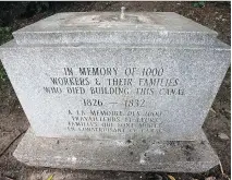  ?? WAYNE CUDDINGTON ?? The granite base is all that’s left at the site of the Celtic cross dedicated to the memory of the workers who died building the Rideau Canal. Visitors are believed to be responsibl­e for breaking it.