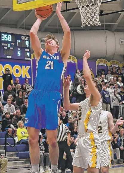  ?? WORSOM ROBINSON/FOR THE SUN-TIMES ?? New Trier’s Ciaran Brayboy scores two of his 12 points against Glenbrook South. He also had six rebounds.