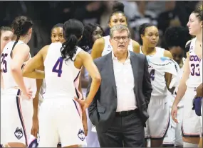  ?? Stephen Dunn / Associated Press ?? Right, UConn coach Geno Auriemma talks to his team during a timeout against Ohio State on Nov. 11.