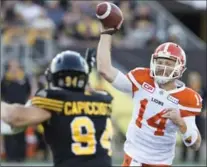  ?? PETER POWER, THE CANADIAN PRESS ?? Lions quarterbac­k Travis Lulay (14) went to work fast after starter Jonathon Jennings went down with a throwing-arm injury.