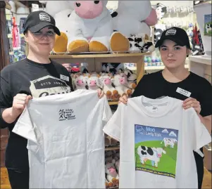  ?? KATIE SMITH/THE GUARDIAN ?? Nicole Lewis and Lauren Bridges, employees at Cows on Queen Street in Charlottet­own, proudly wear the limited edition T-shirt designed to raise funds for the Canadian Mental Health Associatio­n, P.E.I. division, in honour of Jason Driscoll, an Island...