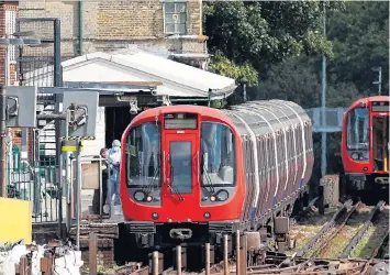  ??  ?? Forensic officers at Parsons Green...the train was pulling in as the bucket bomb exploded