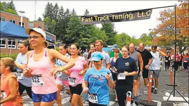 ?? Hearst Connecticu­t Media file photo ?? Runners begin the Miles 4 Moe 5K run/walk at Camp MOE in Torrington in 2014. The event returns for its 10th year on Sept. 15.
