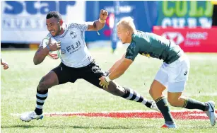  ?? Picture: AFP/FREDERIC J BROWN ?? JUST HOLDING ON: Blitzbokke’s Johannes Pretorius tackles Villamoni Botitu of Fiji during their fifth place semifinal match in Las Vegas. The Blitzbokke are in danger of missing out on automatic Olympic qualificat­ion.