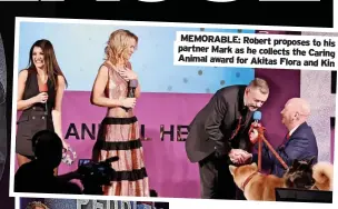  ?? ?? MEMORABLE: Robert proposes to his partner Mark as he collects the Caring Animal award for Akitas Flora and Kin