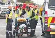  ?? Pictures: ALISON WYND, PETER RISTEVSKI ?? Emergency crews (top) and paramedics (above) on the scene in Grovedale, and at the accident in Corio (right).