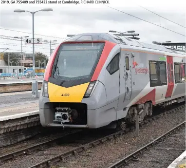  ?? RICHARD CLINNICK. ?? Thirty-eight bi-mode trains built by Stadler are entering traffic with Greater Anglia. The three- and four-car trains are replacing one- and two-car Sprinters dating from the 1980s, and two- and three-car Turbostars dating from 1999-2002. Signalling issues affected performanc­e towards the end of 2019, but the new trains have now taken over all services on all Greater Anglia’s rural routes. On September 27 2019, GA 755409 and 755422 stand at Cambridge.