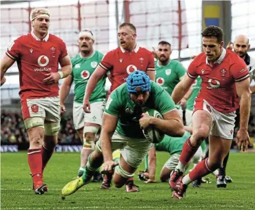  ?? Picture: Lorraine O'sullivan/Reuters ?? Ireland's Tadhg Beirne scores his team’s fourth try during the Guinness Six Nations 2024 match against Wales at the Aviva Stadium in Dublin, Ireland yesterday.