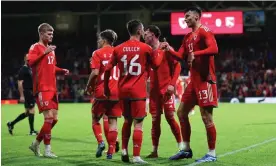  ?? Photograph: Jan Kruger/Getty Images ?? Kieffer Moore (right) is congratula­ted by his teammates after scoring the fourth and final goal of the game.