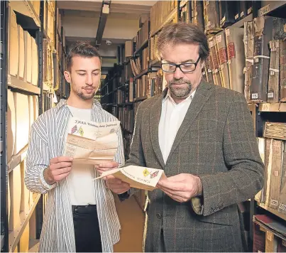  ?? Picture: SWNS. ?? Petros Aronis and Professor Tony Pollard with some of the Bowman letters in archives redacted at Glasgow University.