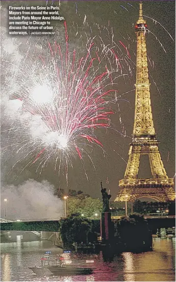  ?? | JACQUES BRINON/ AP ?? Fireworks on the Seine in Paris. Mayors from around the world, include Paris Mayor Anne Hidalgo, are meeting in Chicago to discuss the future of urban waterways.