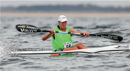  ??  ?? Danielle Mckenzie paddles to victory in the canoe ocean racing world championsh­ips.