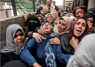  ??  ?? women cry during the funeral of a palestinia­n in beit Hanun, Gaza Strip, on Saturday. —