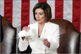  ?? ALEX BRANDON - THE ASSOCIATED PRESS ?? House Speaker Nancy Pelosi of Calif. tears her copy of President Donald Trump’s State of the Union address after he delivered it to a joint session of Congress on Capitol Hill in Washington, Tuesday, Feb. 4.