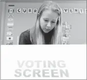  ?? Stuart Gradon, Calgary Herald ?? Caitlin Mckeen, 17, a Grade 12 student at Masters Academy and College, takes part in the Student Vote on April 19.