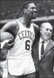  ??  ?? Bill Russell, left, with coach Red Auerbach, missed all 14 of his shots in a loss to Philadelph­ia, 53 years ago today.