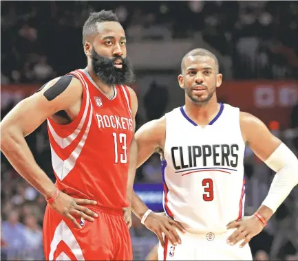  ?? Sean M. Haffey / Getty Images ?? A pair of perennial NBA All-Stars, James Harden, left, and Chris Paul, are together at last, united as Rockets after Wednesday’s deal involving seven players and a protected first-round pick pried Paul from the Clippers’ grasp.