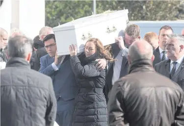  ?? MARTIN McKEOWN ?? James and Janice Bradley carry the coffin of their son Daniel (below) at St Patrick’s Church in Maghera, and (right) the family and mourners