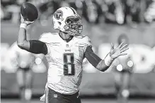  ??  ?? Titans quarterbac­k Marcus Mariota threw for 170 yards in a 27-14 preseason win Saturday at Oakland.